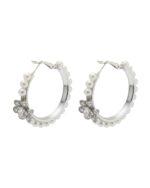 Circular hoop earrings with floral design detailing.