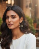 Double layer silver hoop earrings adorned with sparkling stones.