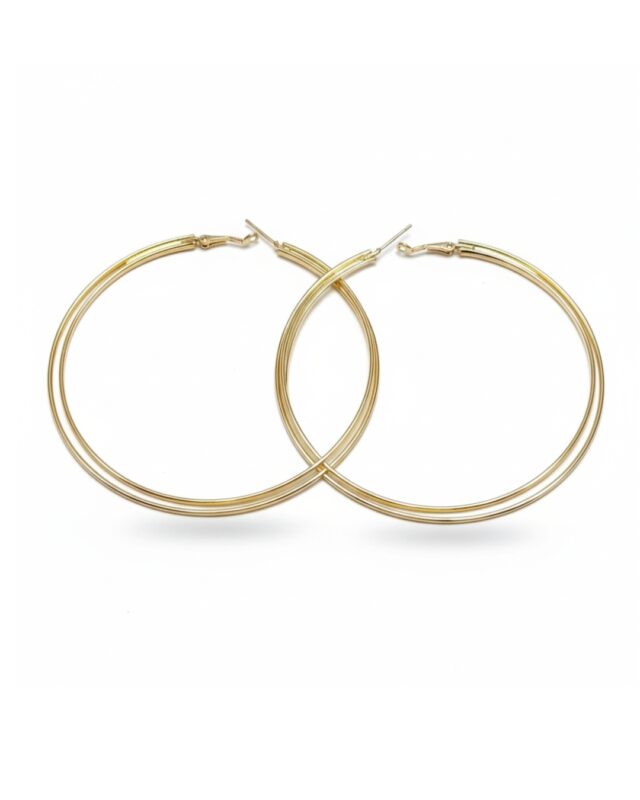 Large tricircular gold hoop earrings with modern bold design.