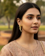 China gold peacock earrings with sparkling stone embellishments and intricate design